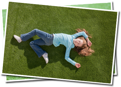 Image of a child laying on grass